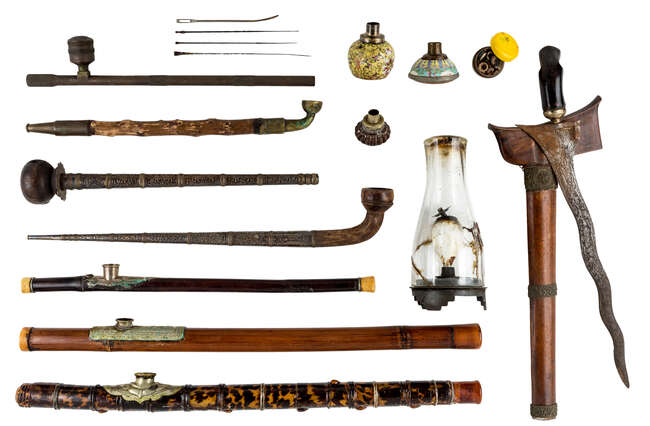 
	
		Three Chinese opium pipes, two tobacco pipes, an opium lamp and a kris, 19th century/...
