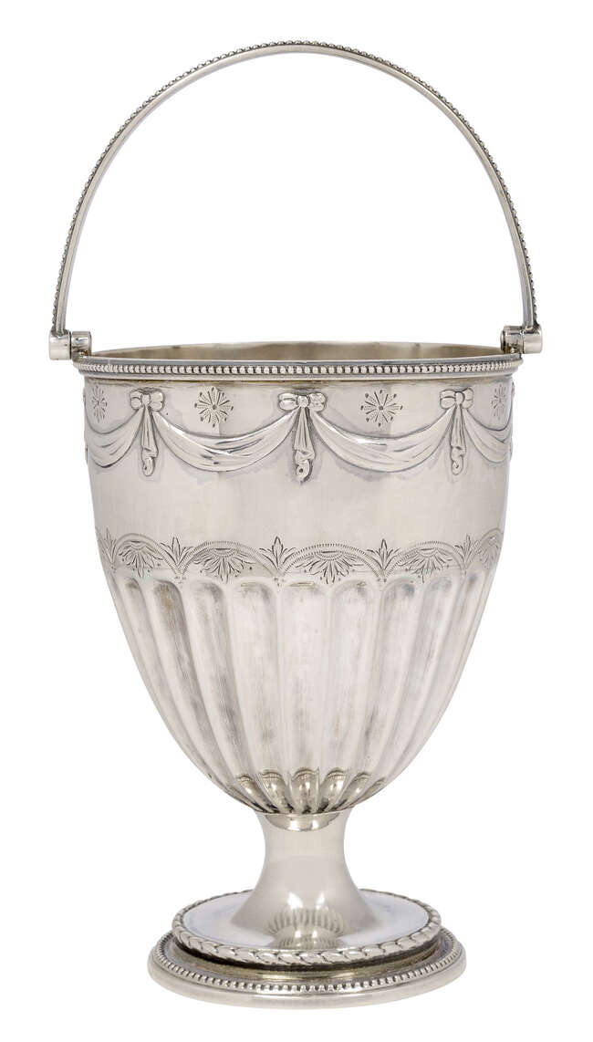 
	
		A Victorian silver swing handled cup vase, London, c.1879, James Beebe, raised on a...