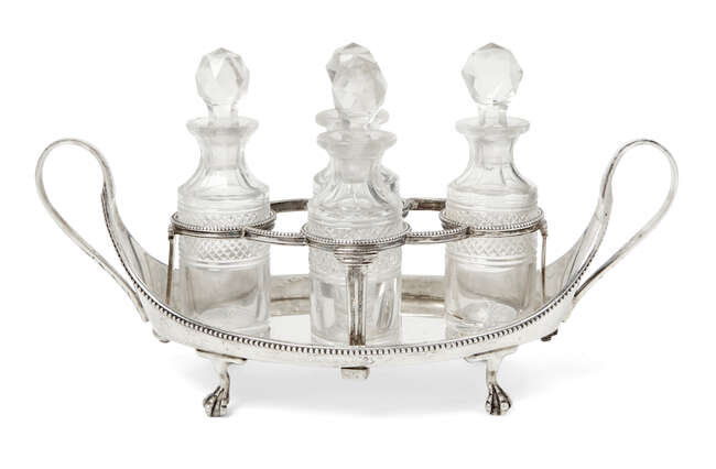 
	
		A George III quatrefoil cruet set, London, c.1784, maker&#39;s mark WS, the twin handled...