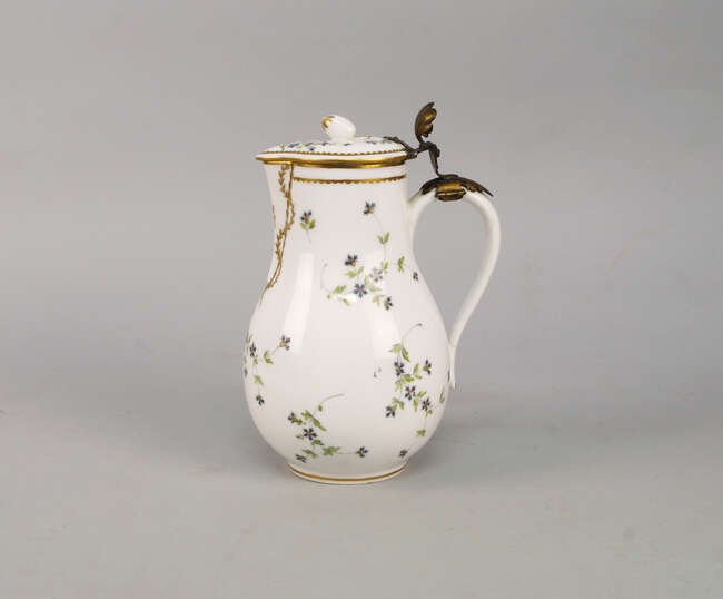 
	
		A French La Courtille porcelain jug and cover, 18th century, with a gilt metal hinge and...