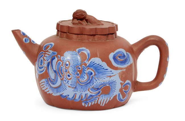 
	
		A Chinese yixing melon-shaped teapot, early 20th century, painted in blue enamels with a...