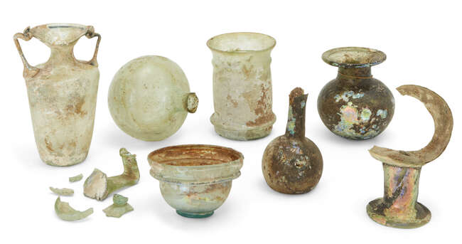 
	
		A collection of Roman glass vessels
		Circa 1st-4th Century A.D., including a small...