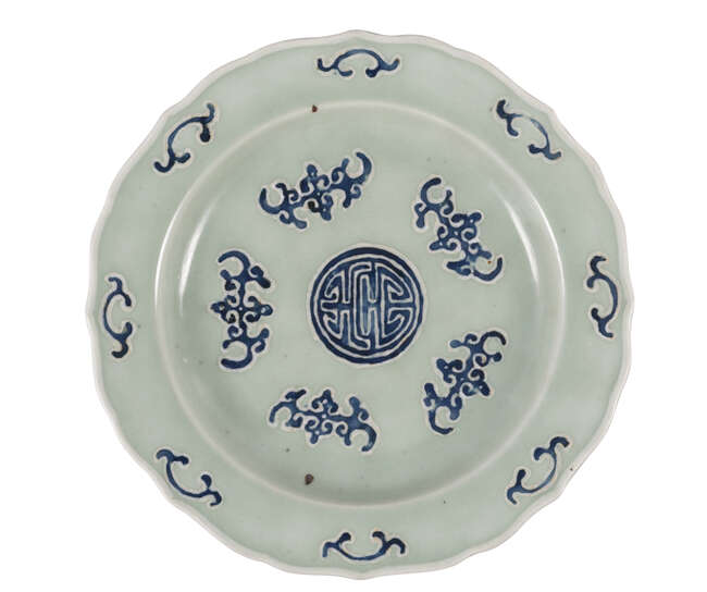 A Chinese 'wufu' dish
Late 19th century
Painted with underglaze blue with five bats on a celadon...