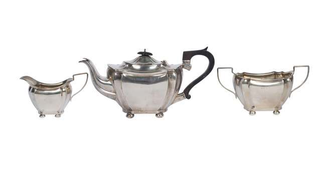 
	
		A silver three piece tea set, Birmingham c.1903, Joseph Gloster Ltd., comprising teapot,...