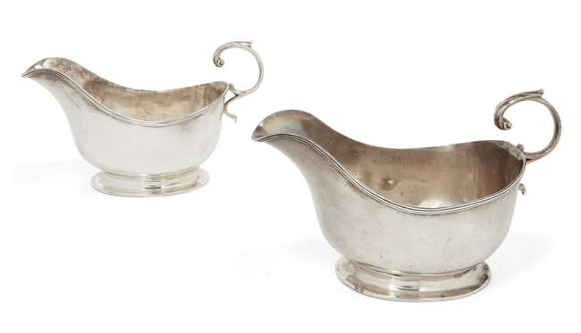 
	
		A pair of silver sauce boats, London, c.1925, Asprey & Co., the plain body of each raised...