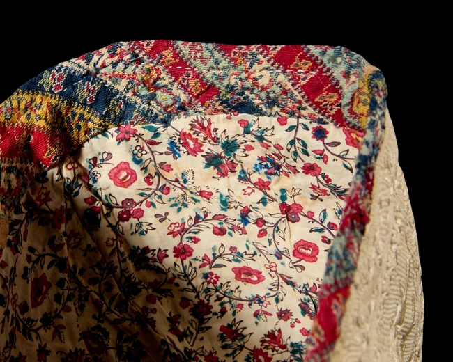 A silk satin stitch and running stitch embroidered and quilted cotton conical hat, Qajar Iran,...