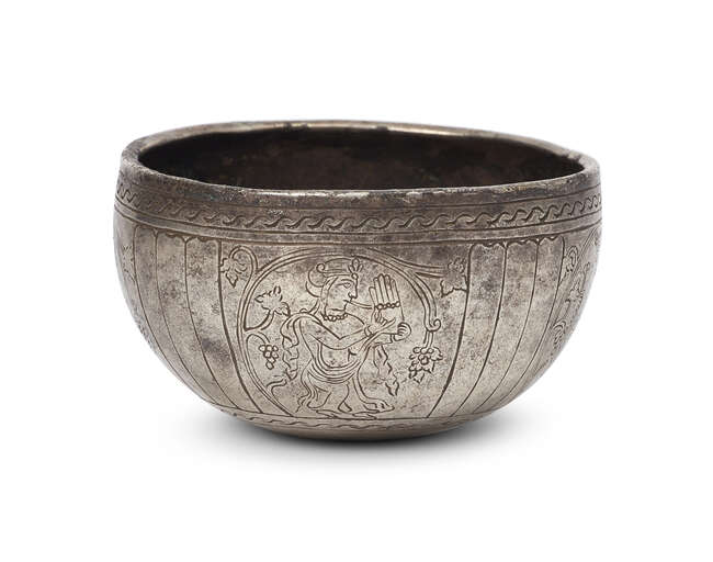 
	
		A Sasanian silver bowl, 6th-7th century A.D., with later added engraved decoration, of...