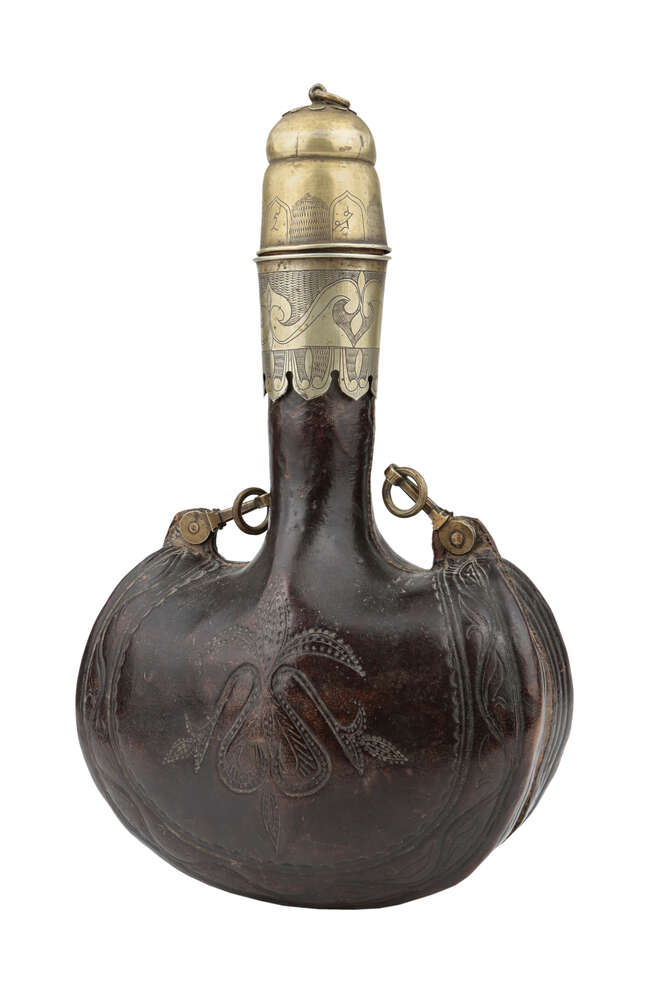 
	
		A rare large inscribed brass-mounted leather flask, North India, 19th century, of typical...