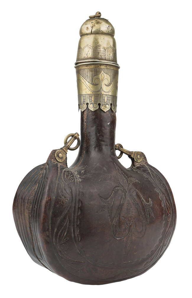 
	
		A rare large inscribed brass-mounted leather flask, North India, 19th century, of typical...