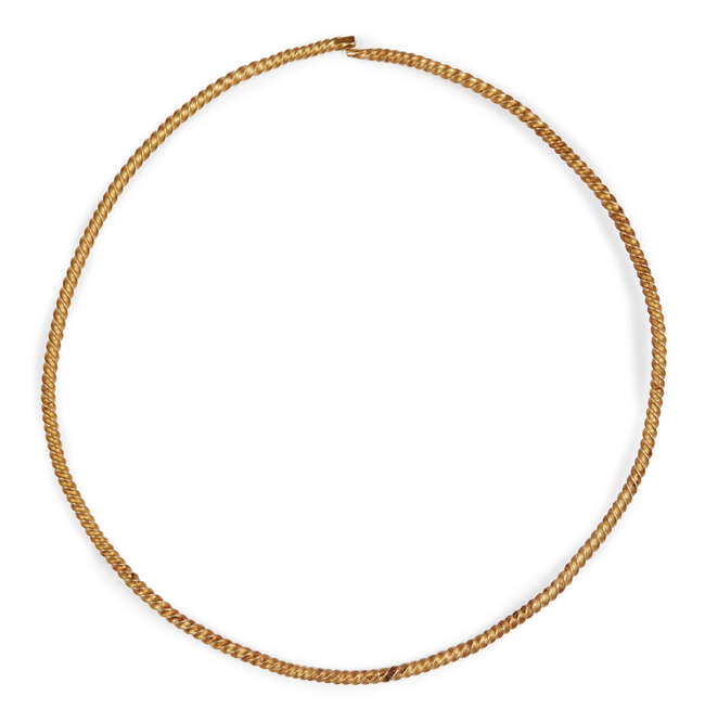 
	
		A twisted solid gold torc necklace, 16.5cm. diam., weight 60.5gr.
		Provenance: Property...