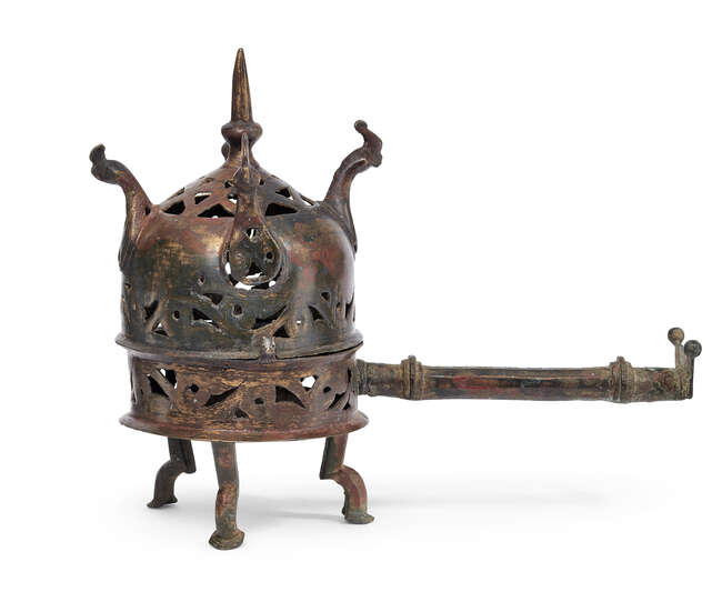 
	
		An openwork Abbasid bronze incense burner, Spain or Iran, 10th-11th century, of domed...
