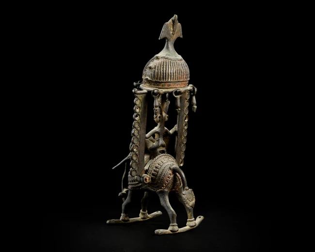 A bronze figure of Indra on Airavata, Bastar, Eastern India, 19th century, 
Under a domed...