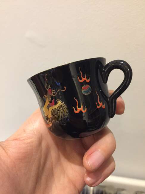 
	
		A Chinese painted lacquer coffee set, 20th century, comprised of eight cups and saucers...