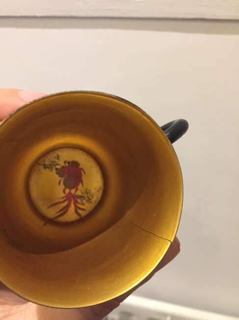 
	
		A Chinese painted lacquer coffee set, 20th century, comprised of eight cups and saucers...