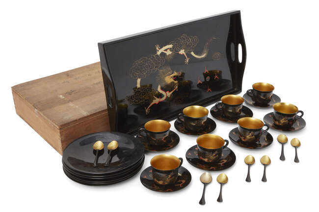 
	
		A Chinese painted lacquer coffee set, 20th century, comprised of eight cups and saucers...