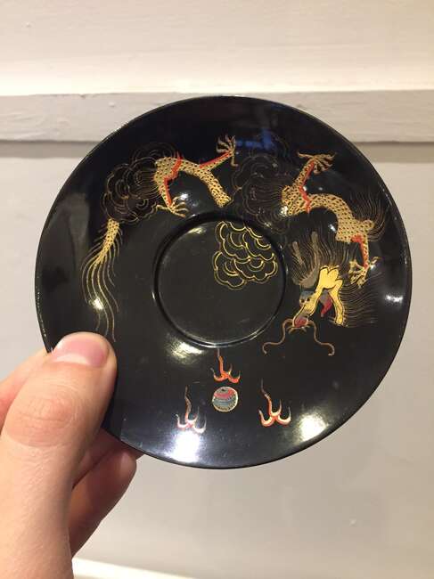 
	
		A Chinese painted lacquer coffee set, 20th century, comprised of eight cups and saucers...