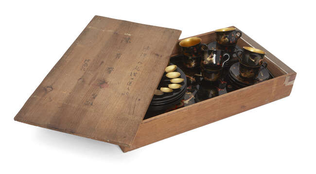 
	
		A Chinese painted lacquer coffee set, 20th century, comprised of eight cups and saucers...