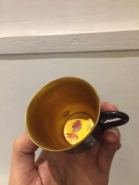 
	
		A Chinese painted lacquer coffee set, 20th century, comprised of eight cups and saucers...