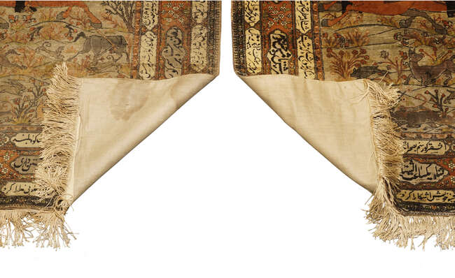 A pair of Persian Kashan silk pictorial rugs, late 19th/early 20th century, woven with nobleman...