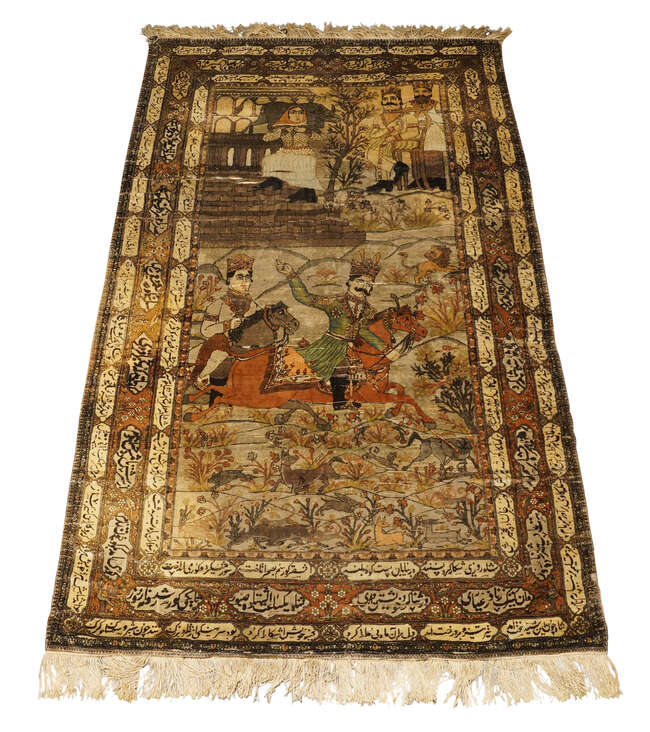 A pair of Persian Kashan silk pictorial rugs, late 19th/early 20th century, woven with nobleman...
