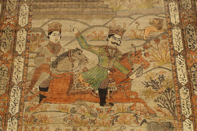 A pair of Persian Kashan silk pictorial rugs, late 19th/early 20th century, woven with nobleman...