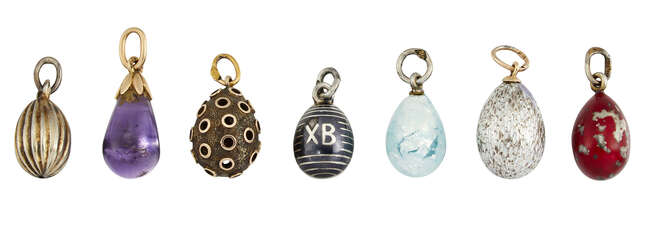 
	
		Seven various Imperial Russian silver and gold egg pendants, the designs including an...