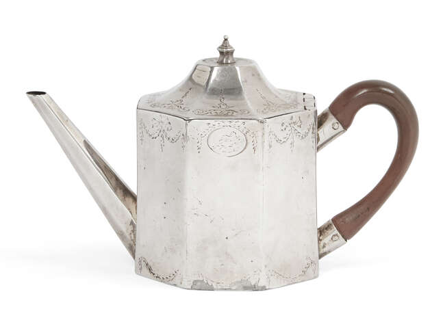 
	
		A George III silver tea pot, London, c.1774, Samuel Wood, of octagonal form with curved...