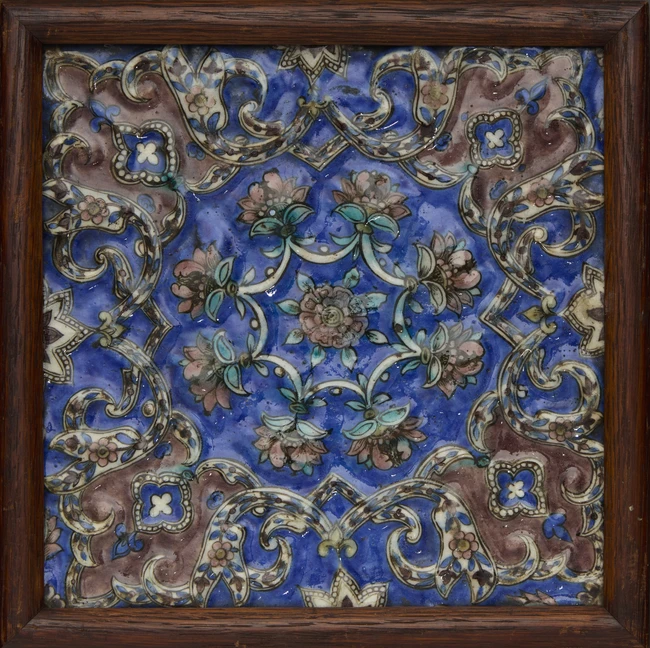 A square moulded pottery tile, Qajar Iran, 19th century, 
The polychrome painted decoration...