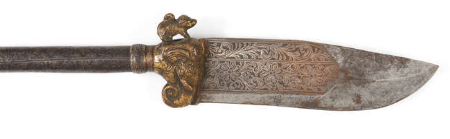
	
		A gilt-copper elephant axe (Bhuj), India, Kutch, 19th century, the broad single-edged...