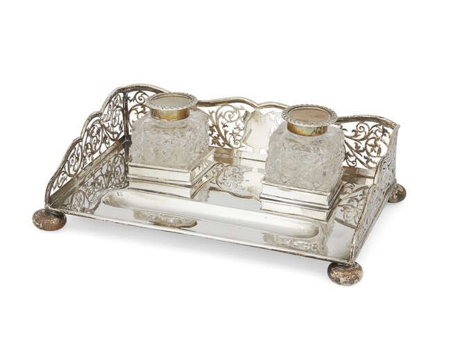 
	
		A pierced silver inkstand with squared cut glass inkwells, Birmingham, c.1906, S. Glass, 