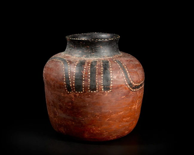 A Mayan red-slip glazed pottery vessel,Circa 2nd century AD,
22.5cm. high
Provenance: Property...