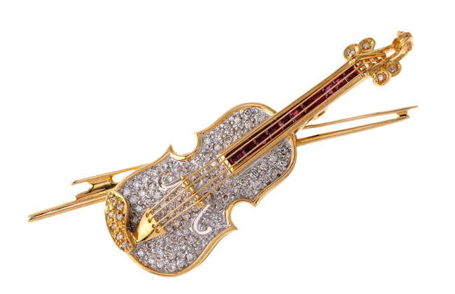 
	
		A diamond and ruby violin brooch/pendant, the pave diamond violin with diamond set pegs...
