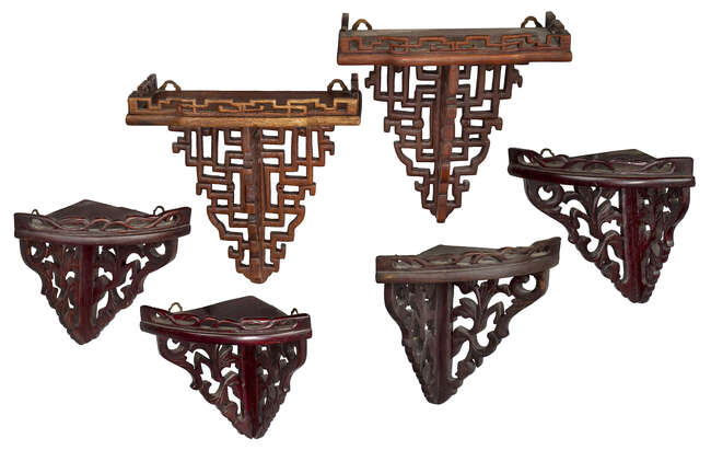 
	
		Three pairs of Chinese wood fret-work wall brackets, second half 20th century, including...