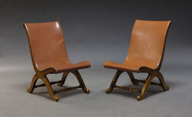 
	
		Pierre Lottier, a pair of beech and leather slipper chairs, made by Valenti, Spain, c....