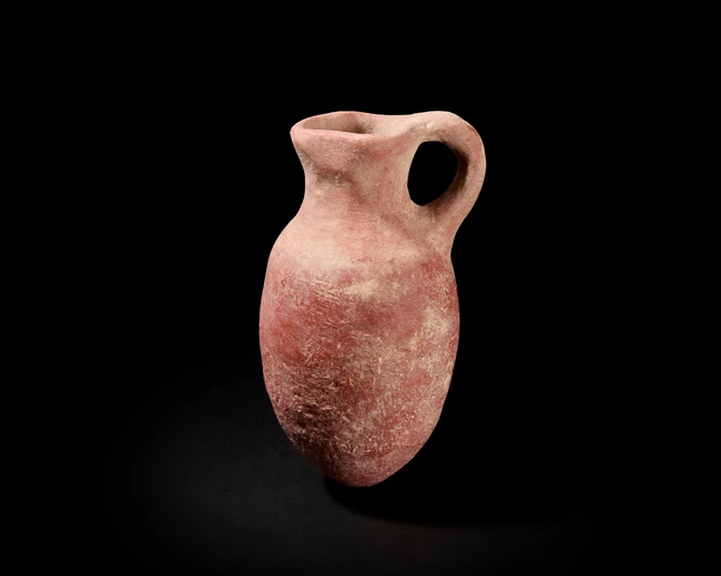 PART I ANTIQUITIES, ISLAMIC AND INDIAN ARTS LOTS 1-256
ANTIQUITIES
An unglazed terracotta Iron...