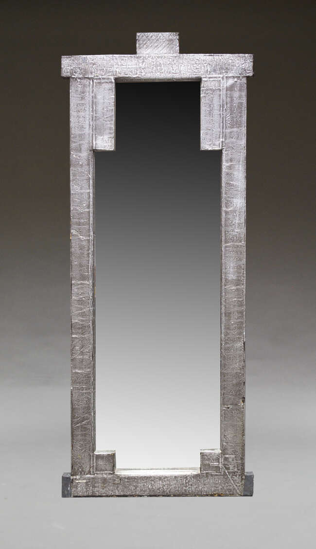 
	
		A large contemporary metal clad mirror, late 20th Century, of rectangular form, with...
