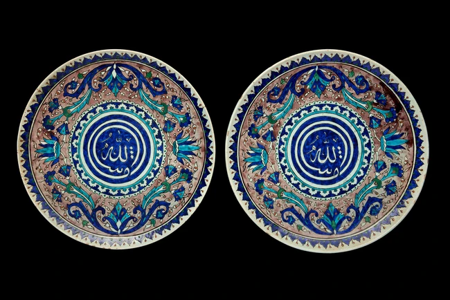 Two Kutahya pottery dishes, Turkey, 20th century, 
Each shallow, on short straight foot, the...