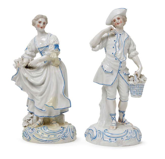 
	
		A pair of 19th Century German blue and white porcelain figures, The Grape Pickers, bears...