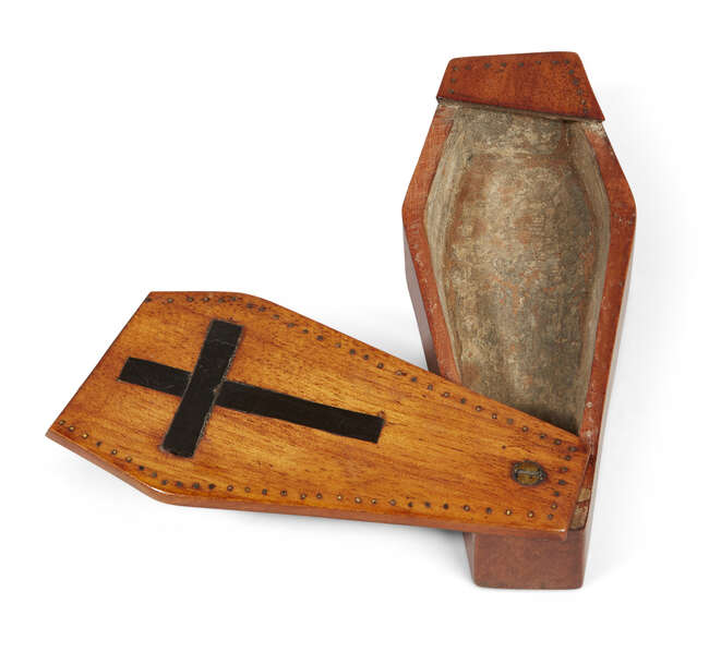
	
		A miniature satinwood coffin-shape needle box, 19th century, the sliding top with cross...