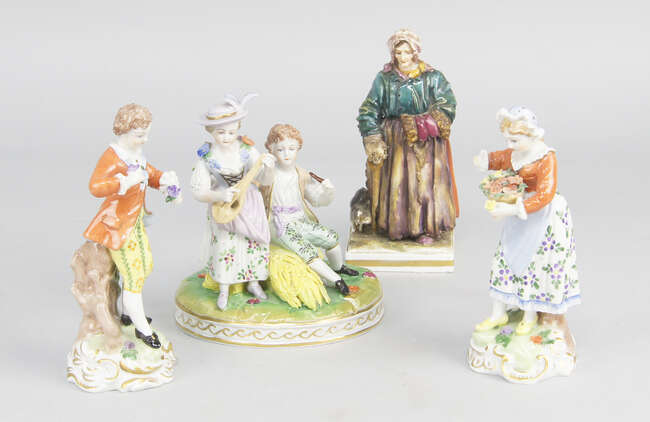 
	
		A pair of Dresden porcelain figures of a boy and girl, 20th century, he in a red coat...