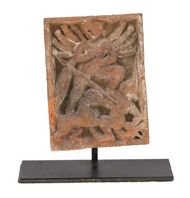 
	
		A terracotta carved brick depicting Durga killing the buffalo demon, Gupta period, of...