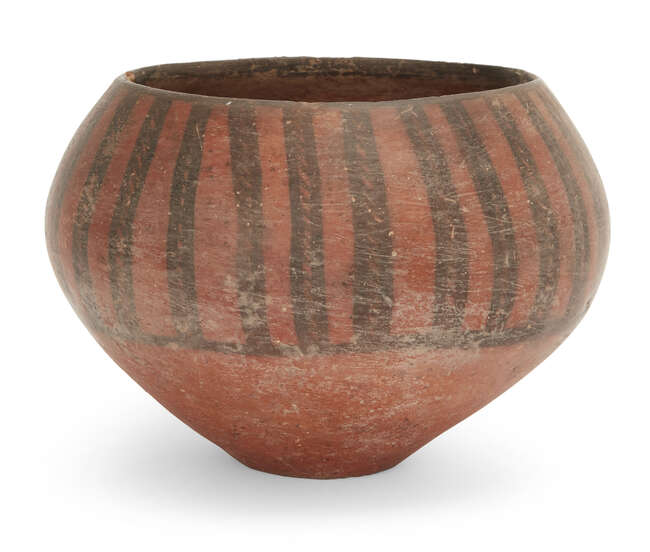 
	
		An Iranian pottery deep bowl
		Circa 4th-3rd Millennium B.C.
		the swollen body with...