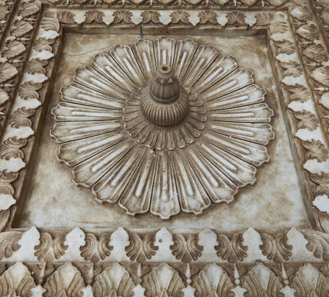 An Indian carved marble fountain, late 19th-early 20th century, of square form, the deeply...