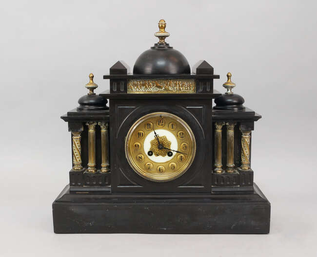 
	
		A Victorian black slate clock, the case of Classical architectural taste with three domed...