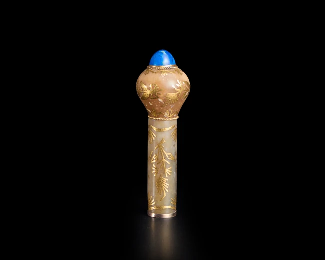 A green hardstone and gold inlaid walking stick handle, Possibly India and for the export...