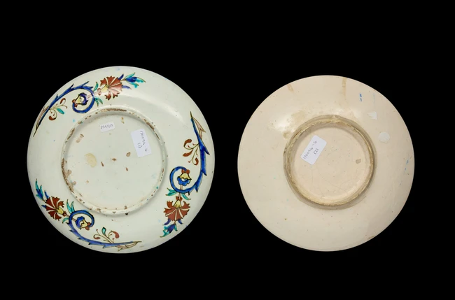 Two Kutahya rimless pottery dishes, Turkey, 20th century, 
Each shallow, on short straight...