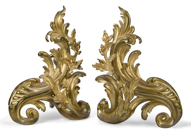 
	
		A pair of French gilt-bronze chenets, first half  20th century, each of scrolling foliate...