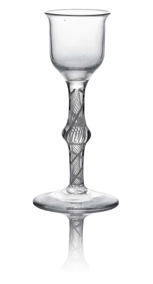 
	
		A George III wine glass, c. 1770, with round funnel bowl above a double series opaque...