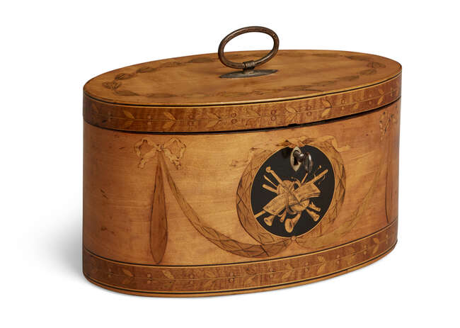 
	
		A George III satinwood oval inlaid two-division tea caddy, inlaid with musical trophies...