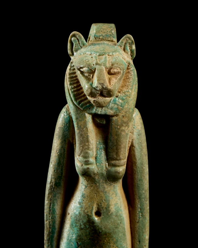 A large Egyptian blue-green faience amulet of the lioness-headed goddess Sekhmet, Third...